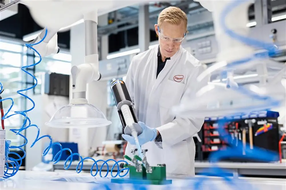 Male lab technician bonding dispensing