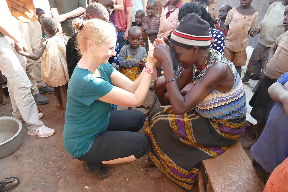 Gabriele Haak with the mother of one of the girls who lives in the Mirembe Cottage